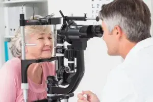 Senior woman being examined by optometrist