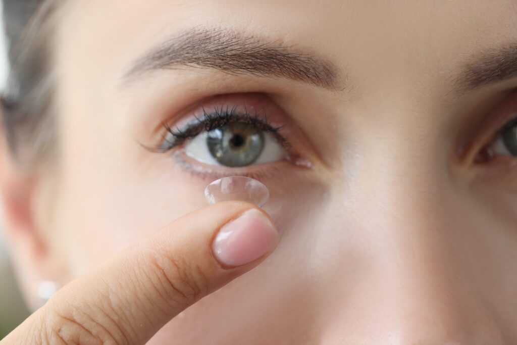 Close-up of woman putting in contact